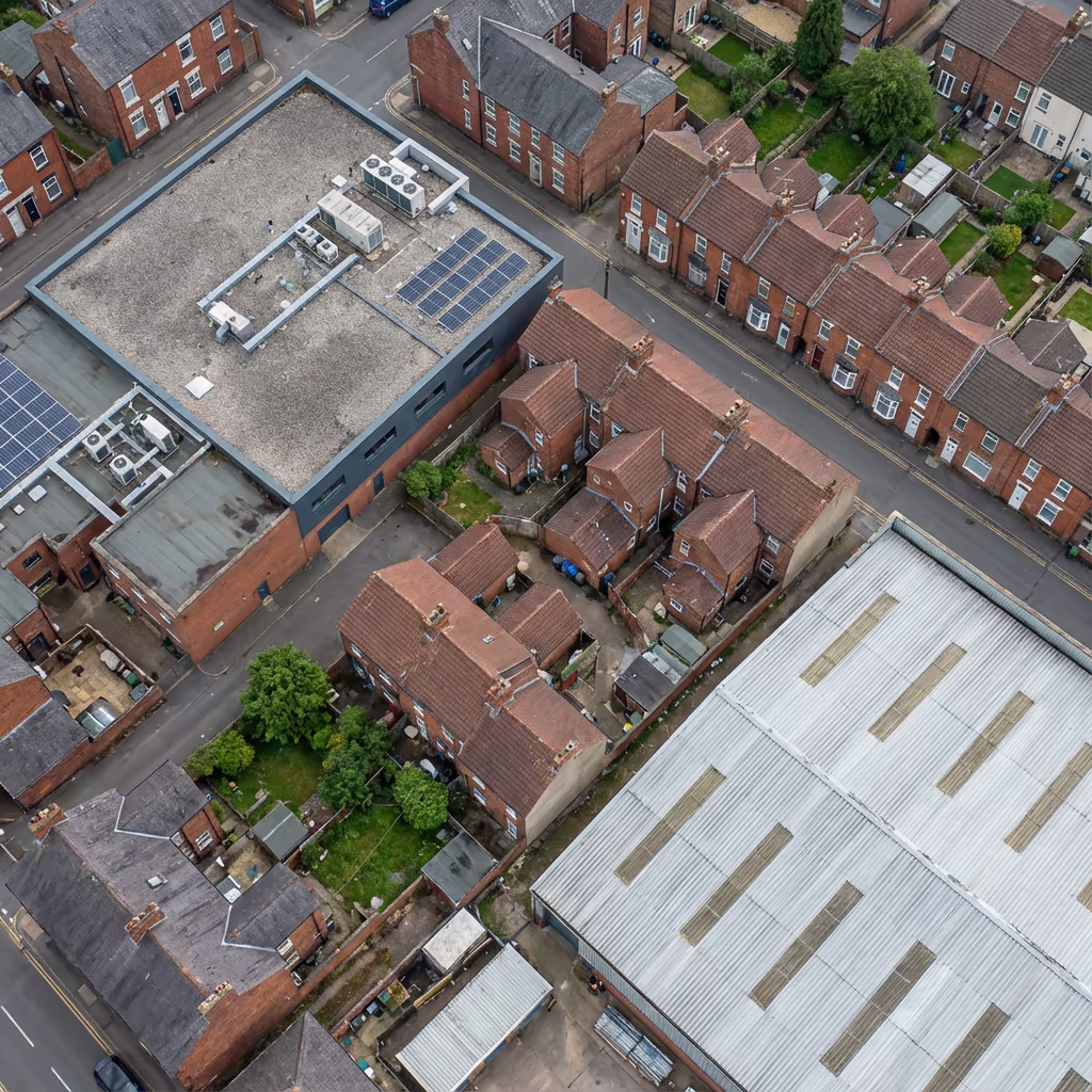 Various roof types from above - commercial flat, residential pitched, industrial